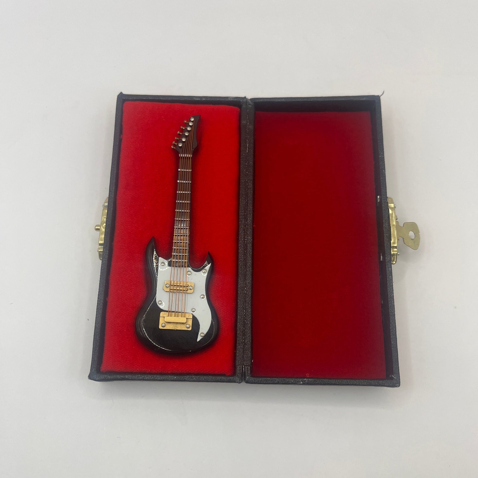 Dolls house electric guitar in case