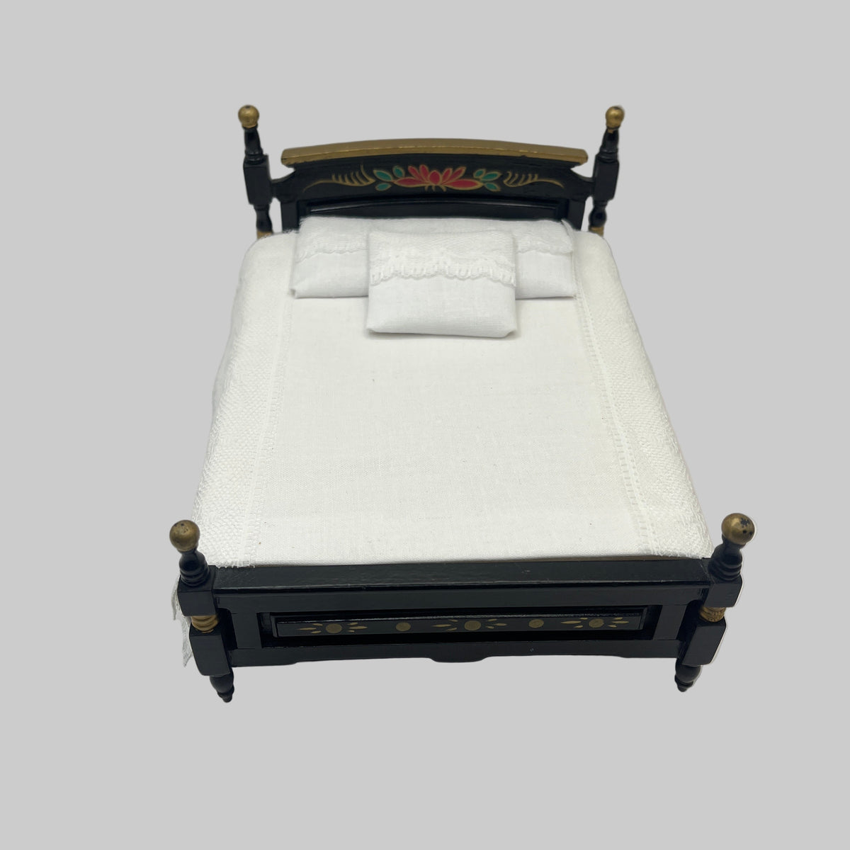 AB022 - Black and gold double bed with white bedding