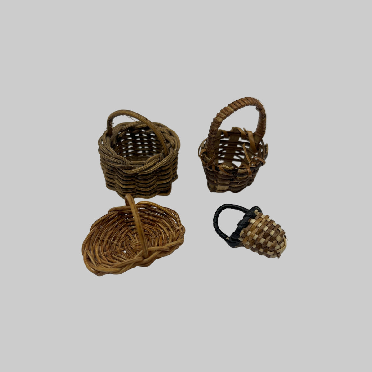 Four wicker carry baskets