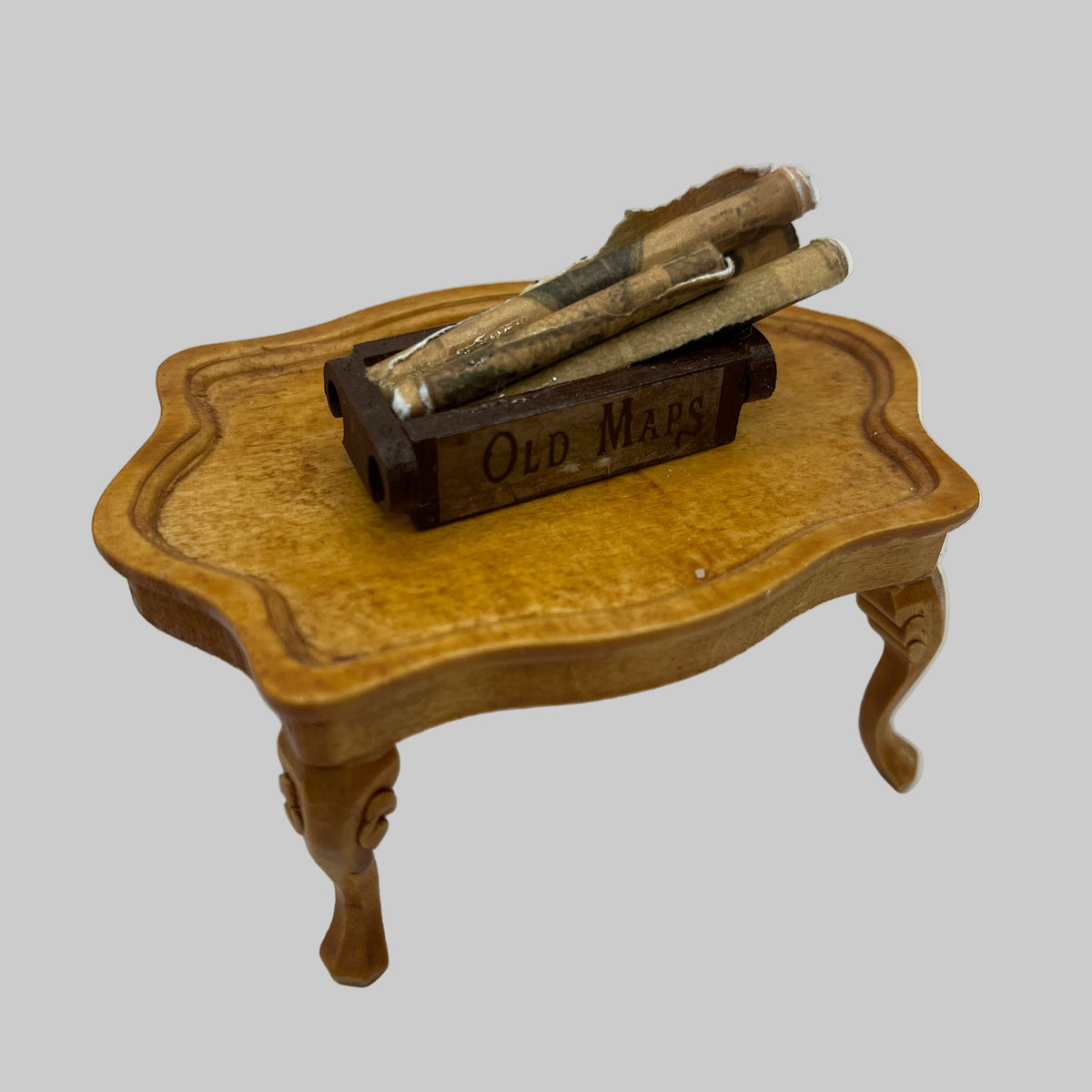 Dolls house crate of old maps