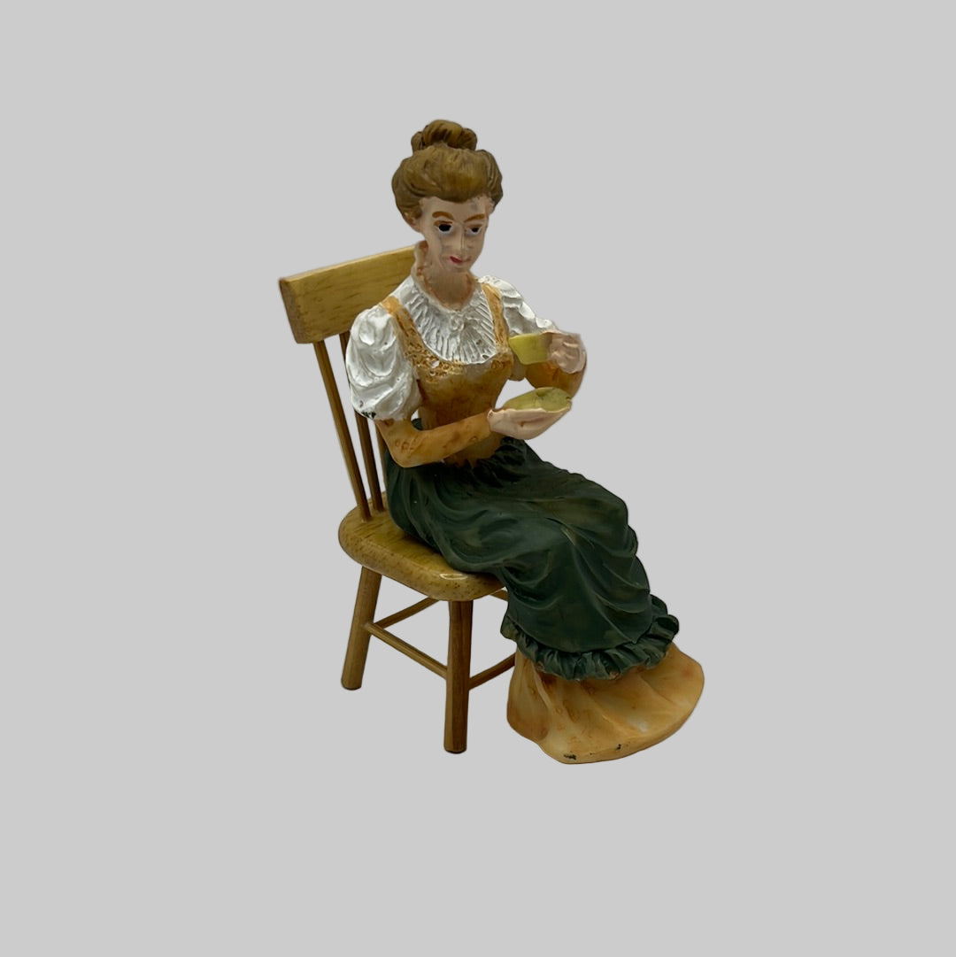 DP203 - Seated resin lady drinking tea