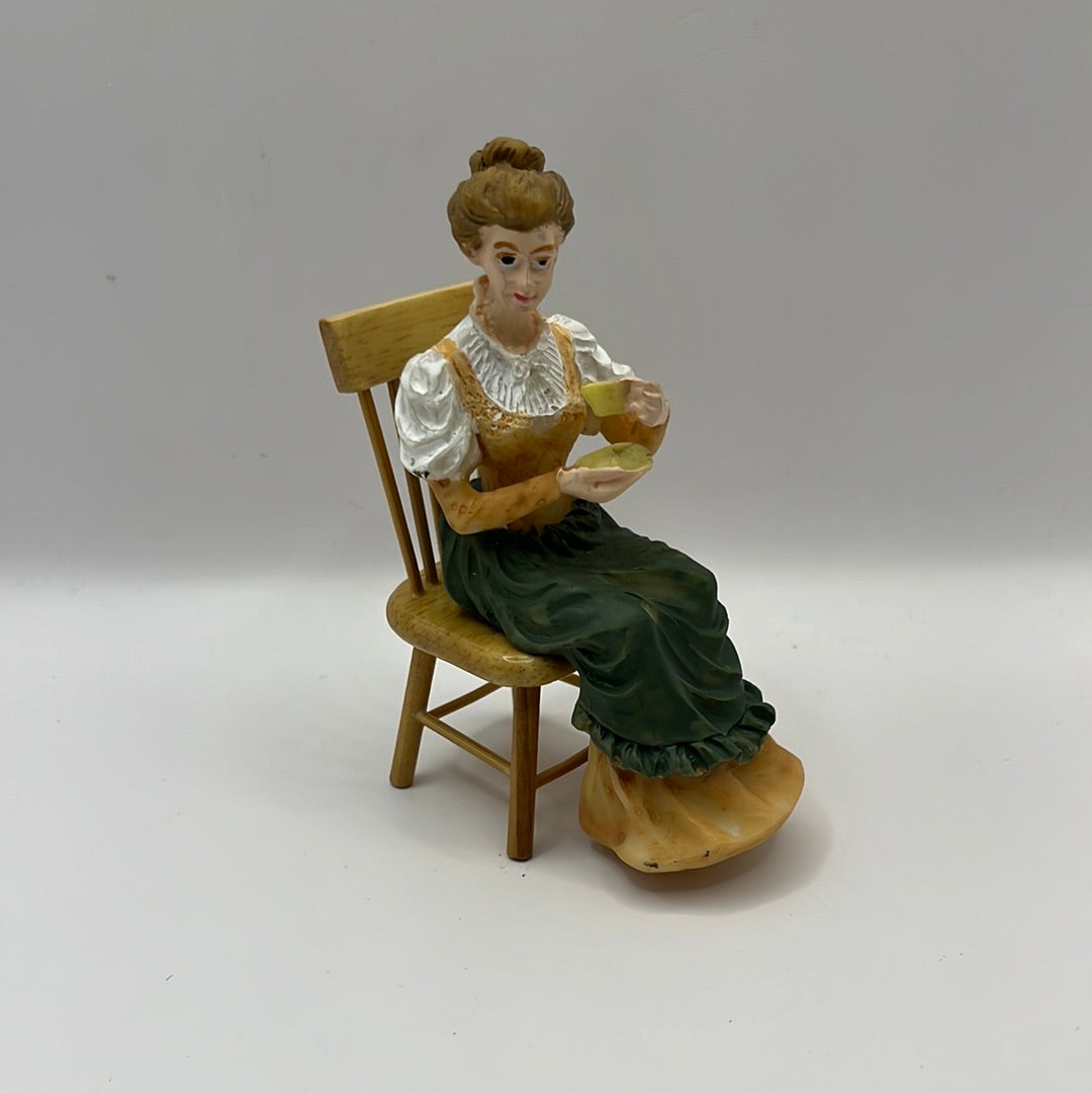 DP203 - Seated resin lady drinking tea