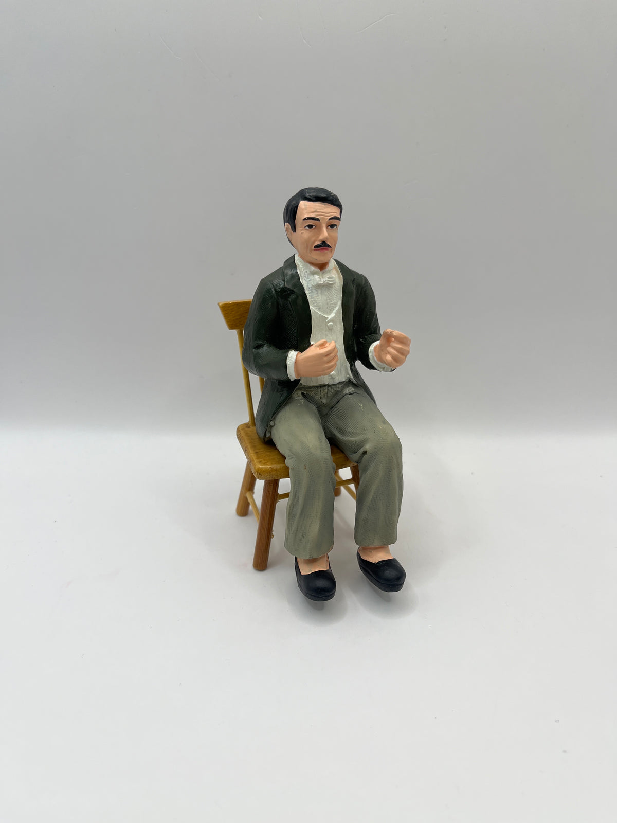 DP241 - Seated resin man with black hair