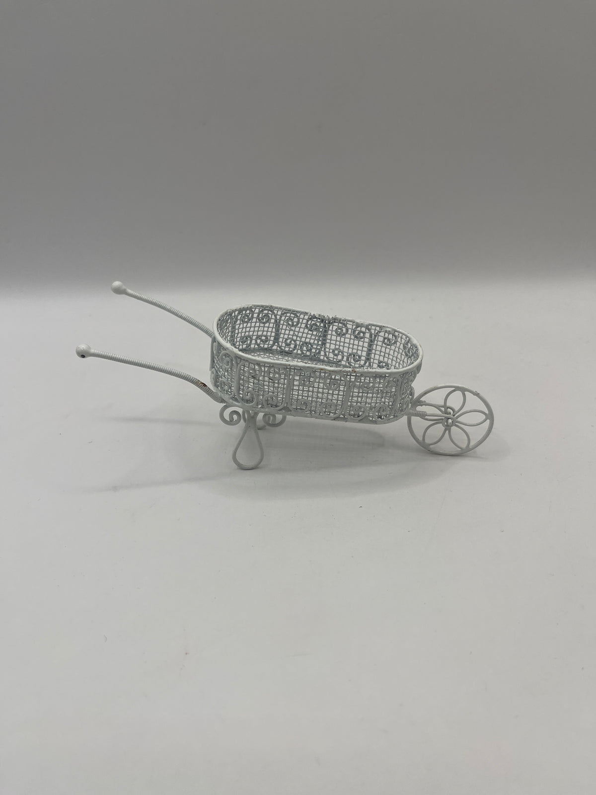 OUT007 - White metal wheelbarrow
