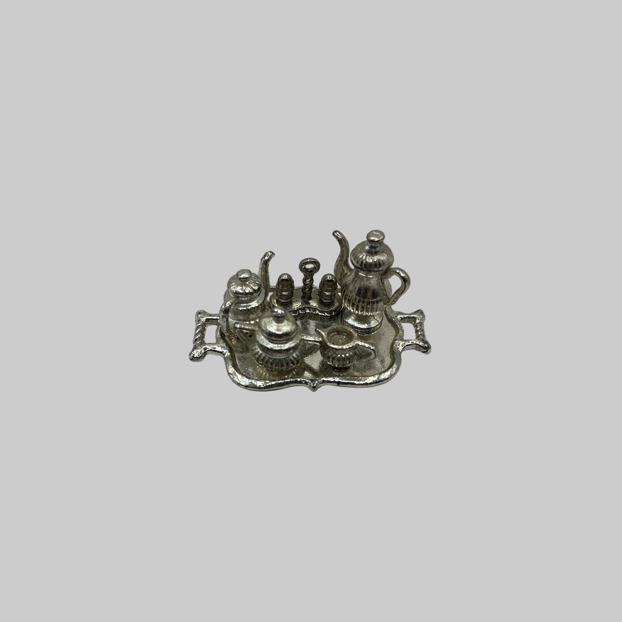 Silver tea set on tray
