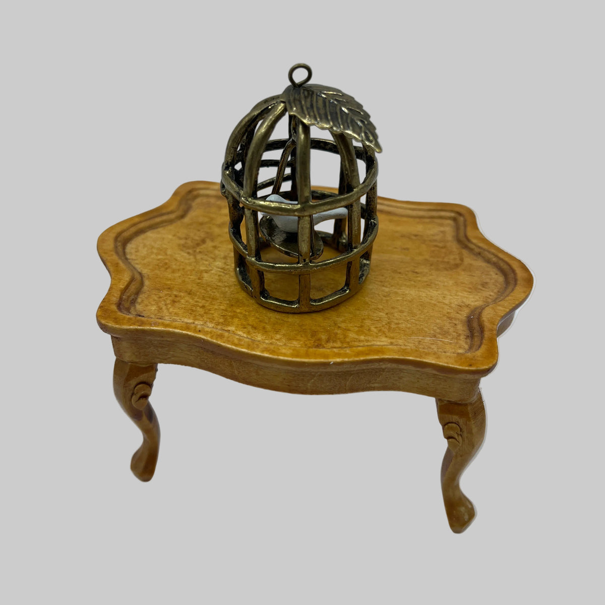 Dolls house bird in gilded cage