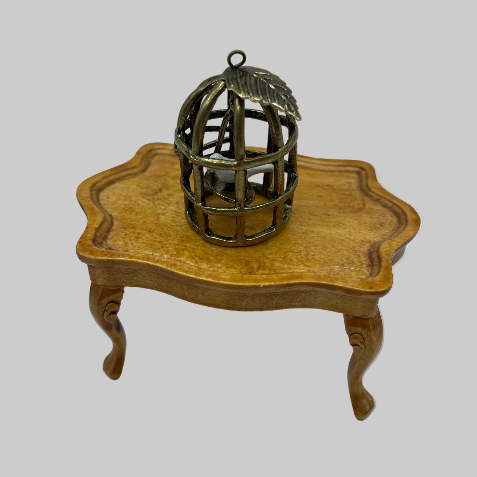 Dolls house bird in gilded cage