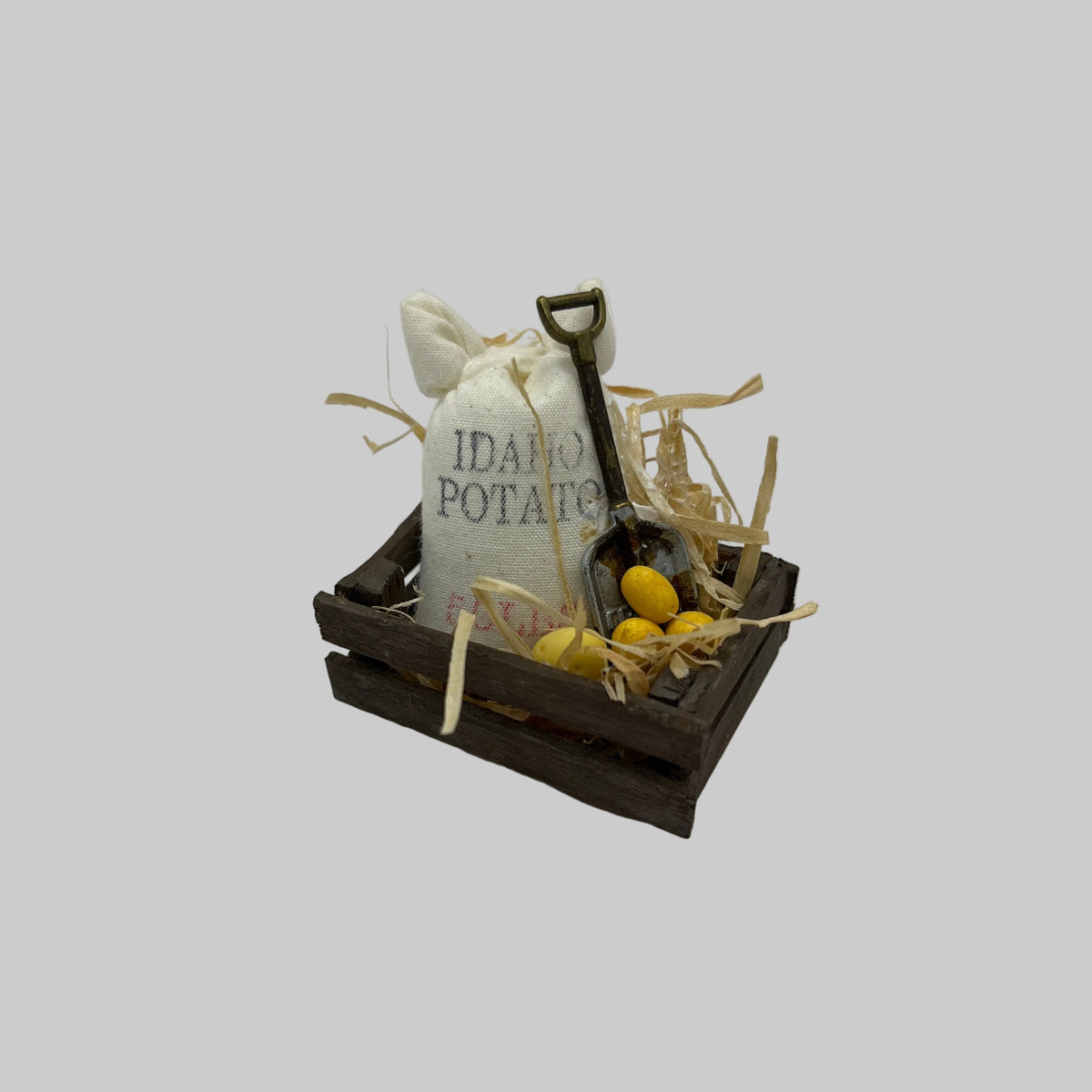 Dolls house crate of potatoes