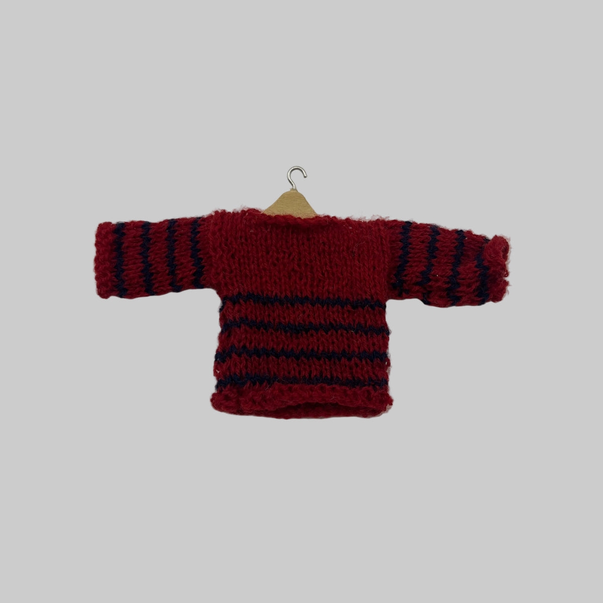 Dolls house jumer on hanger