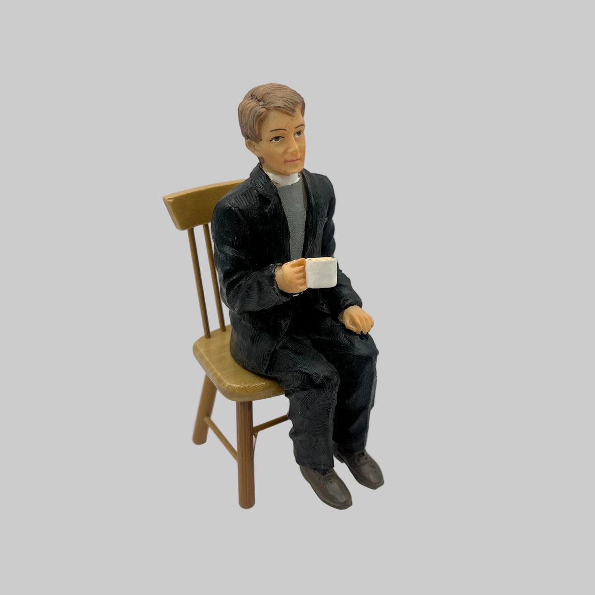Dolls house resin Vicar drinking tea