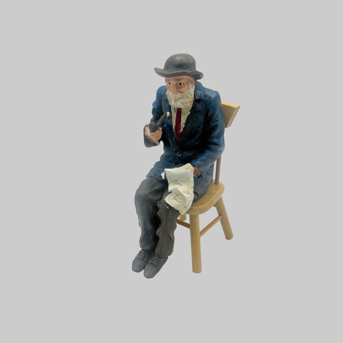 Dolls house Seated resin man with pipe