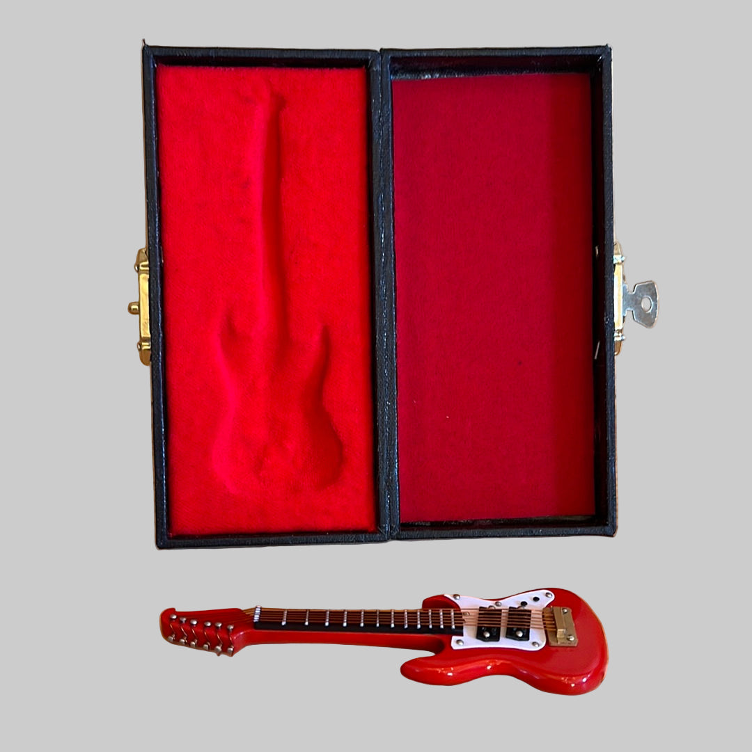 Red Washburn electric guitar in case